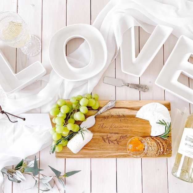 inspiration - "LOVE" plates set on a table with charcuterie board and wine