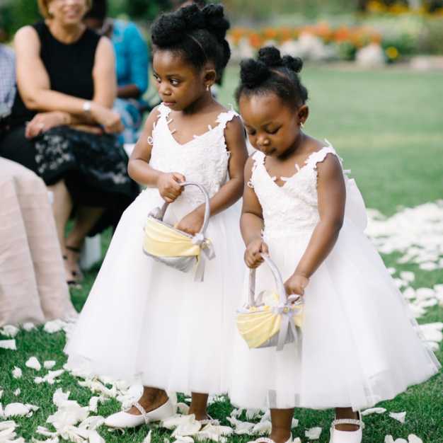 inspiration - two flower girls with flower baskets scattering petals along the aisle